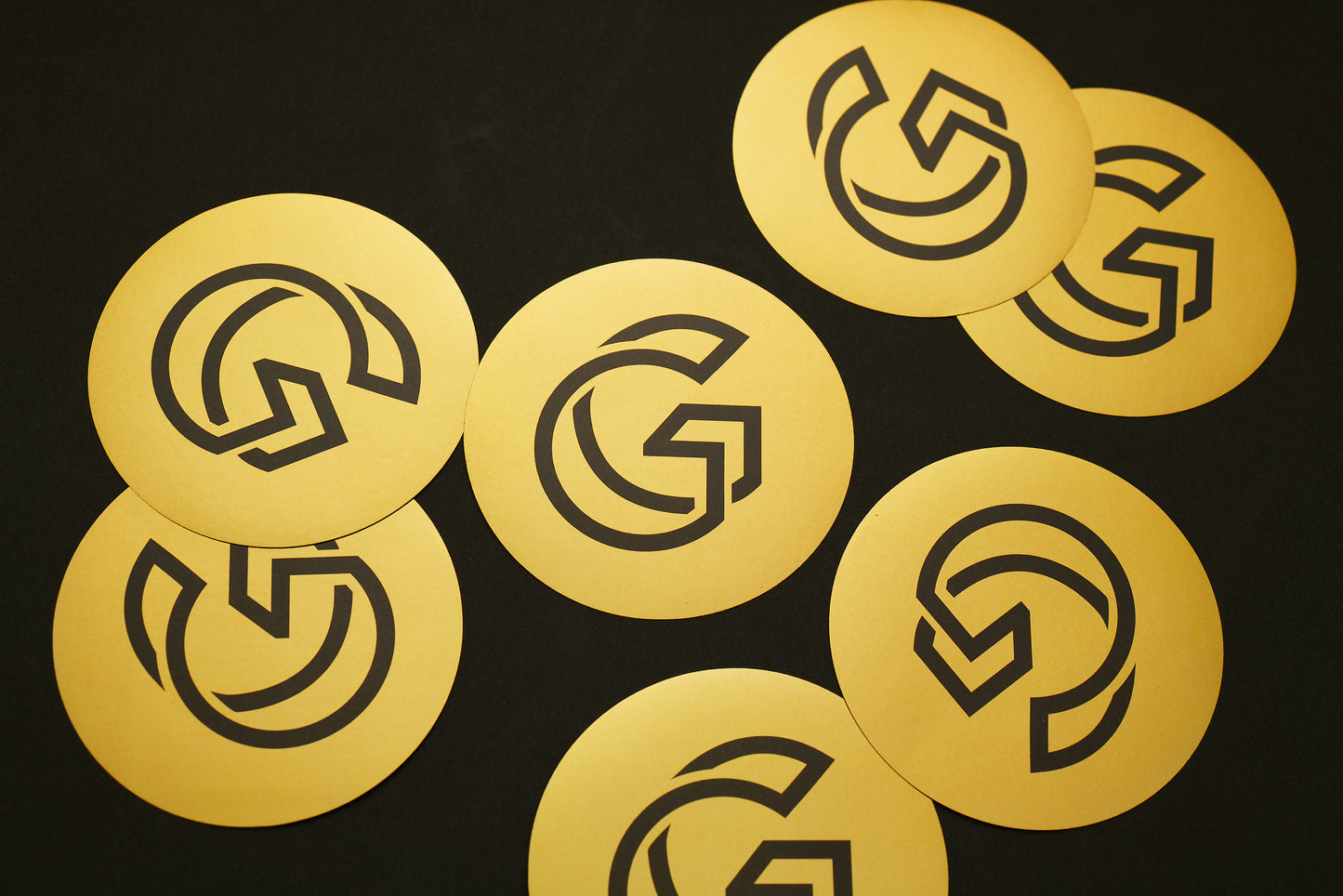 Gold stickers with black 'G' Gallery logo