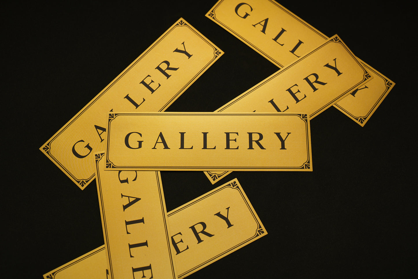 Gold stickers with black Gallery text logo