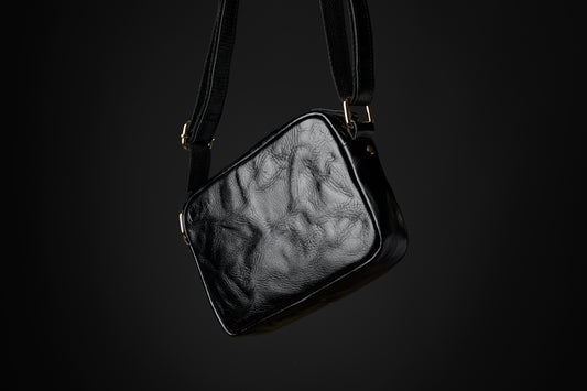 Back of the Acolyte leather cross body bag