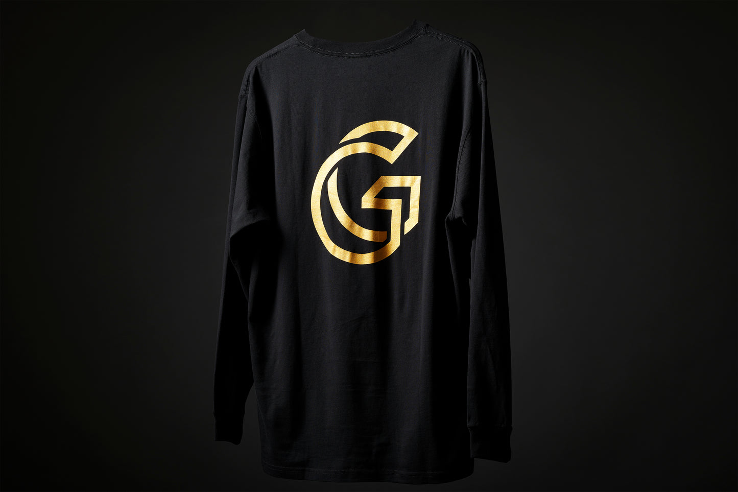 Rear view of the Monarch tee, showing large gold 'G' Gallery logo